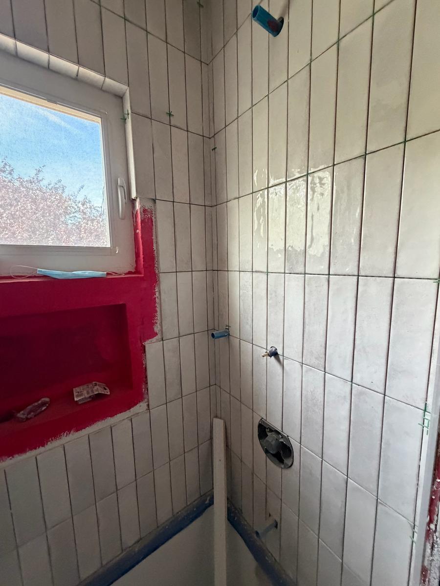 Shower tile corner with niche and plumbing rough-in