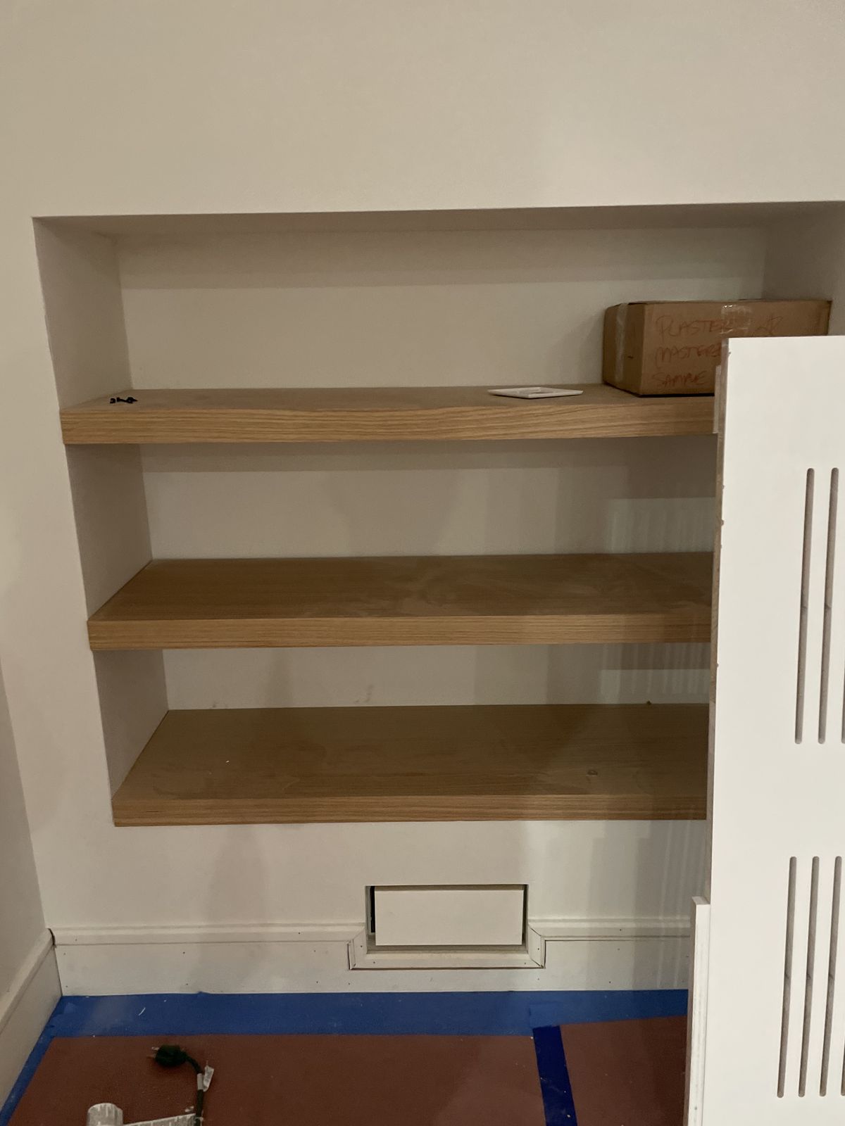 Built-in bookshelf and storage unit with LED accent lighting