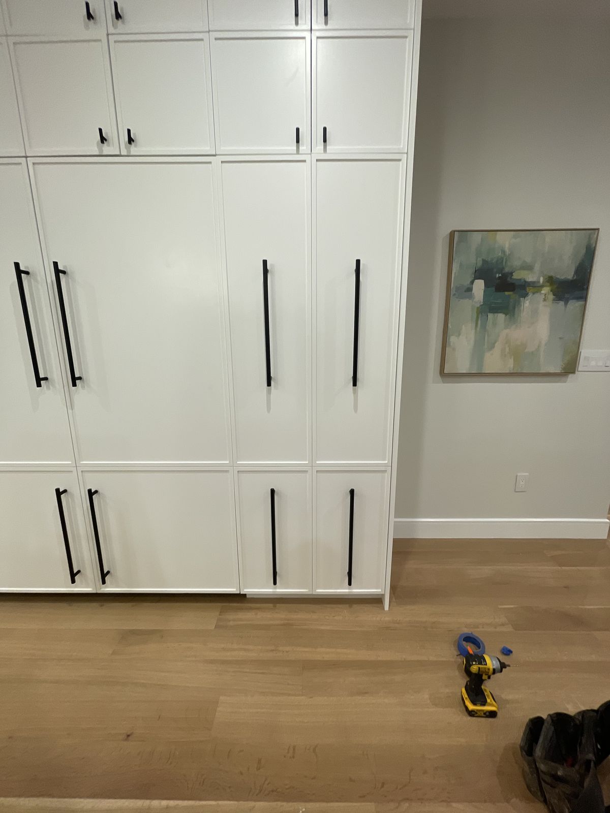 Built-in entertainment center with floating shelves and cable management