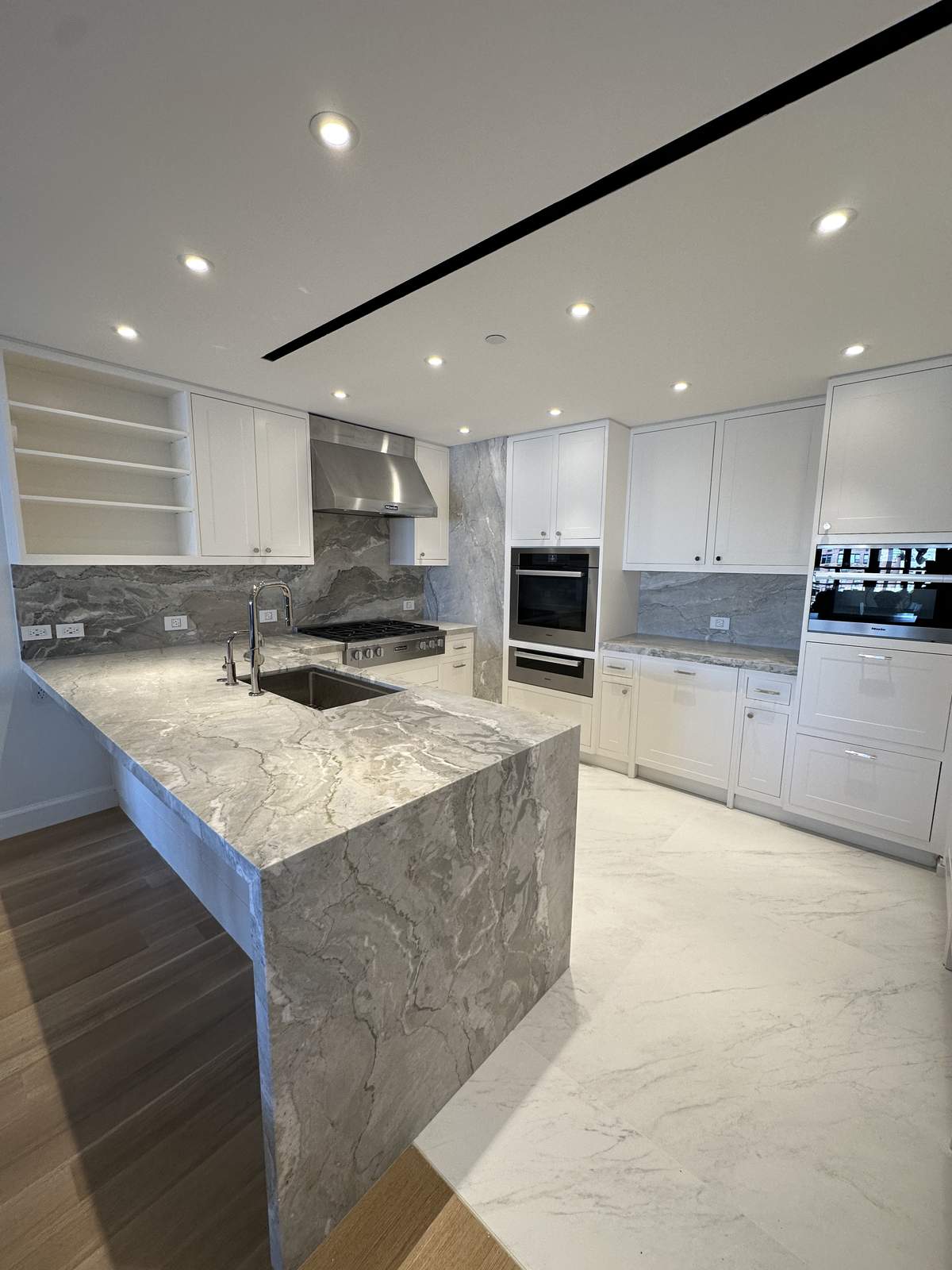 Kitchen renovation with custom shaker cabinets and quartz counters
