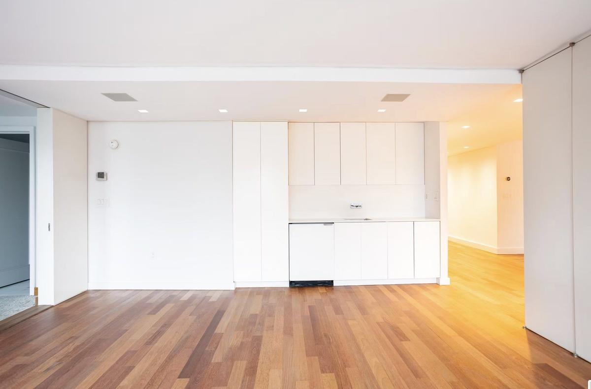 Open-concept living area with custom built-ins in Upper West Side apartment renovation