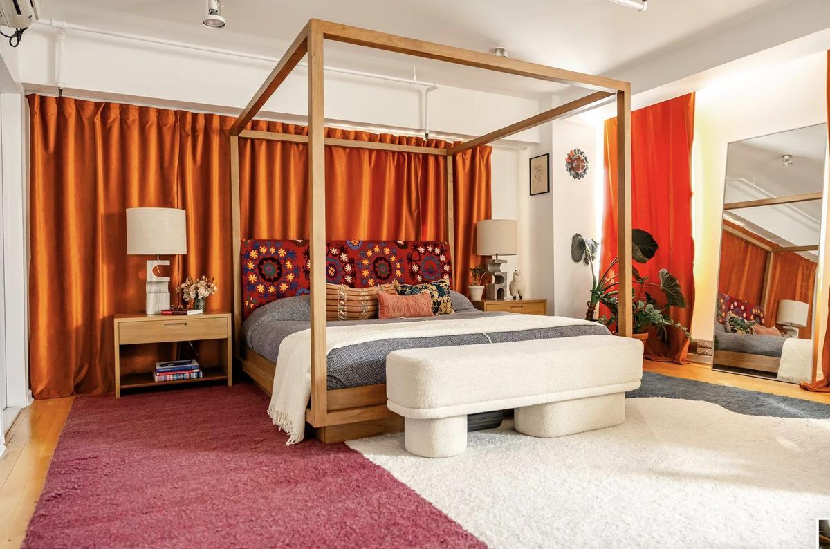 Master bedroom with custom closet system and refinished wood flooring in Nolita loft